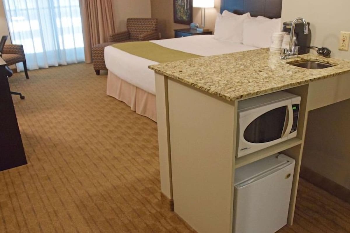 Premium bedding, desk, laptop workspace, soundproofing