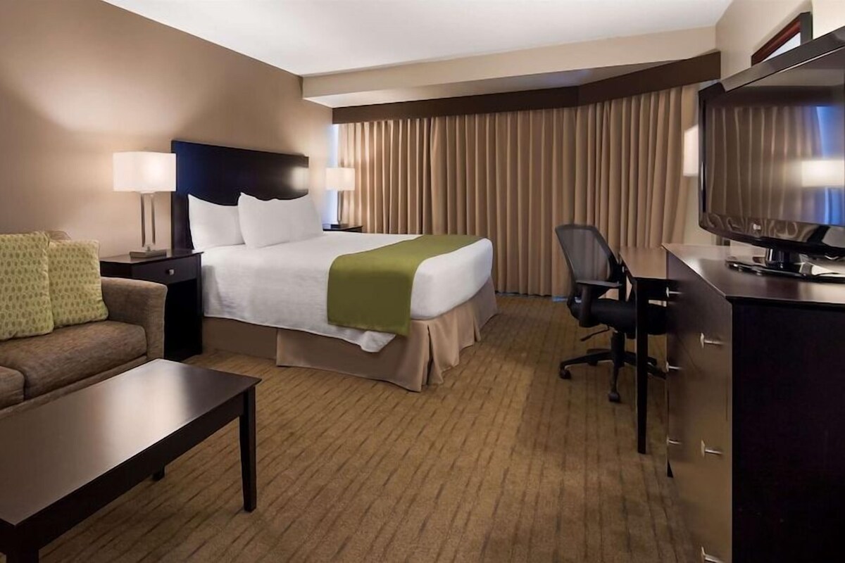 Premium bedding, desk, laptop workspace, soundproofing