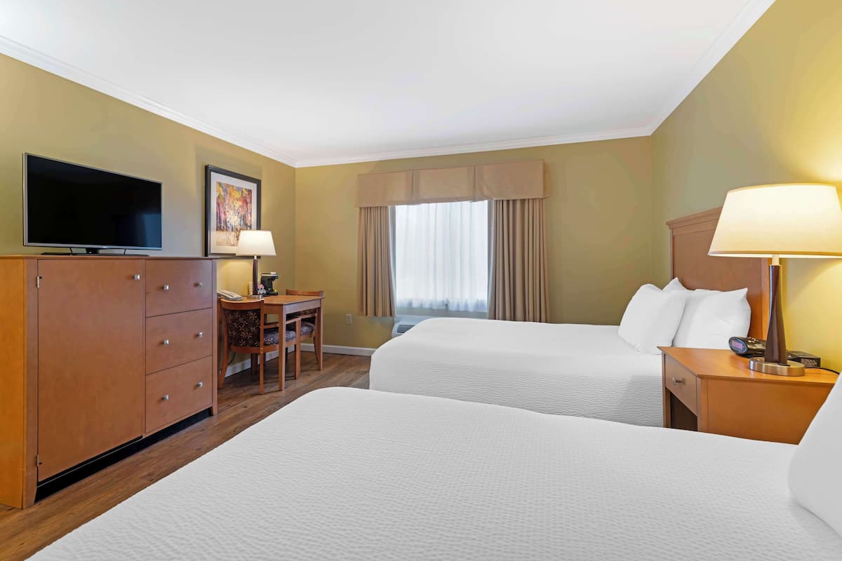 Blackout drapes, iron/ironing board, free cribs/infant beds