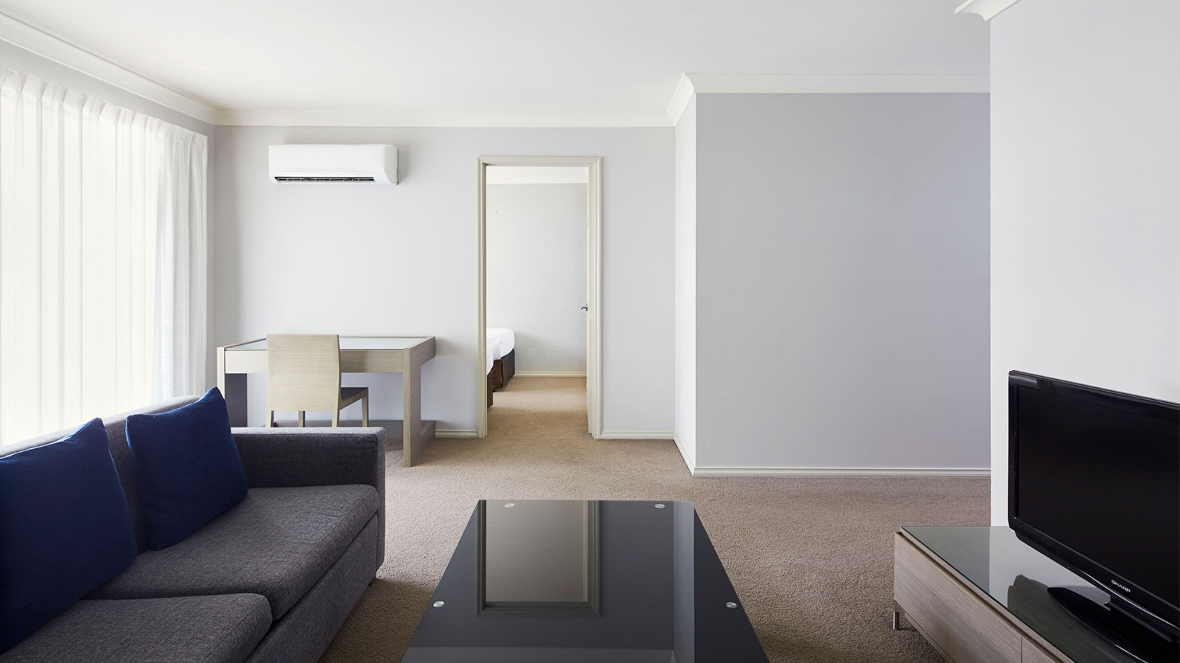Two Bedroom Deluxe Apartment  | Living area | 30-inch LCD TV with premium channels, TV