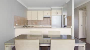 Two Bedroom Deluxe Apartment | Private kitchen | Full-size fridge, microwave, oven, stovetop