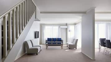 Three Bedroom Deluxe Apartment (2nd Floor - Stairs Only) | Living area | 30-inch LCD TV with premium channels, TV