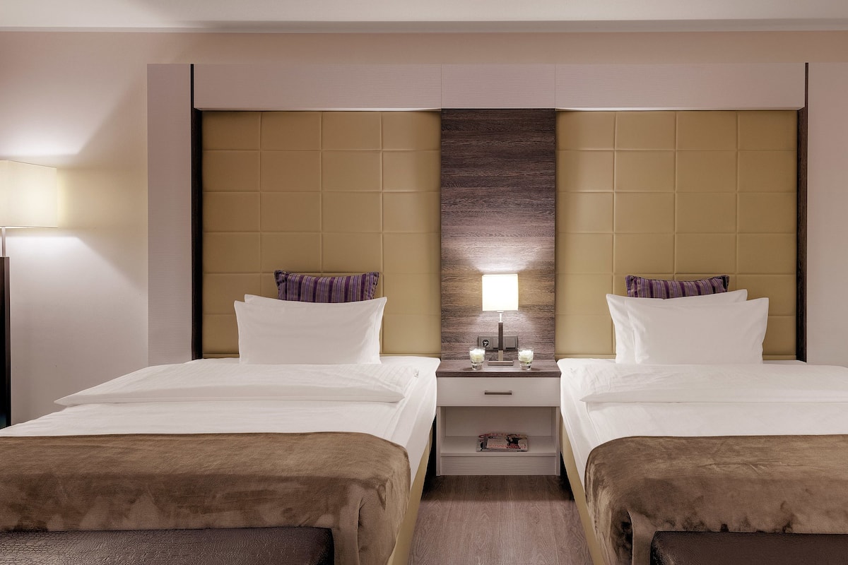 Hypo-allergenic bedding, free minibar items, in-room safe, desk