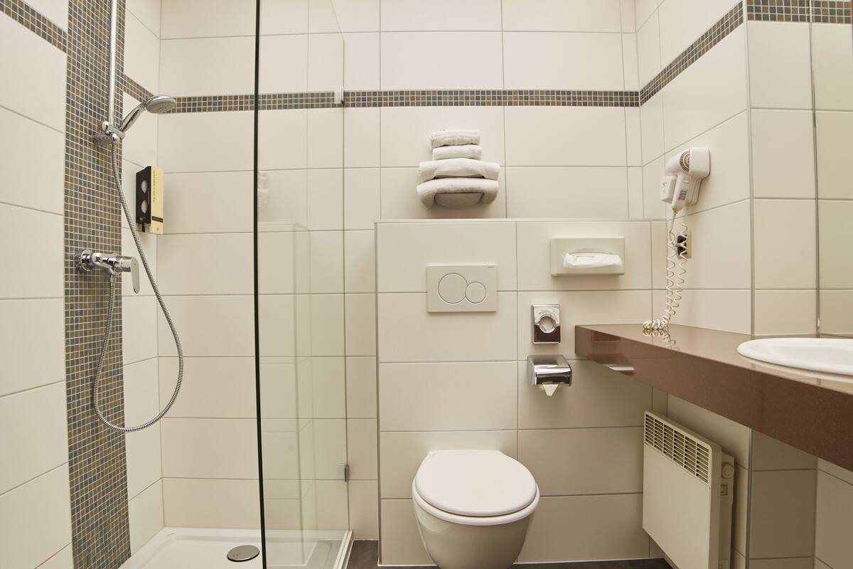 shower, hair dryer, bathrobes, towels