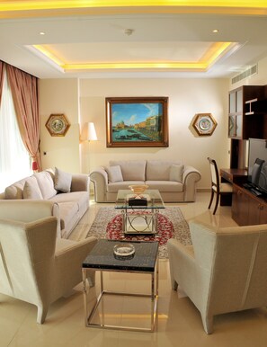 Three-Bedroom Suite Family | Living room | 40-inch TV with satellite channels, DVD player