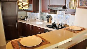 Three-Bedroom Suite Family | Private kitchen | Fridge, microwave, coffee/tea maker, electric kettle