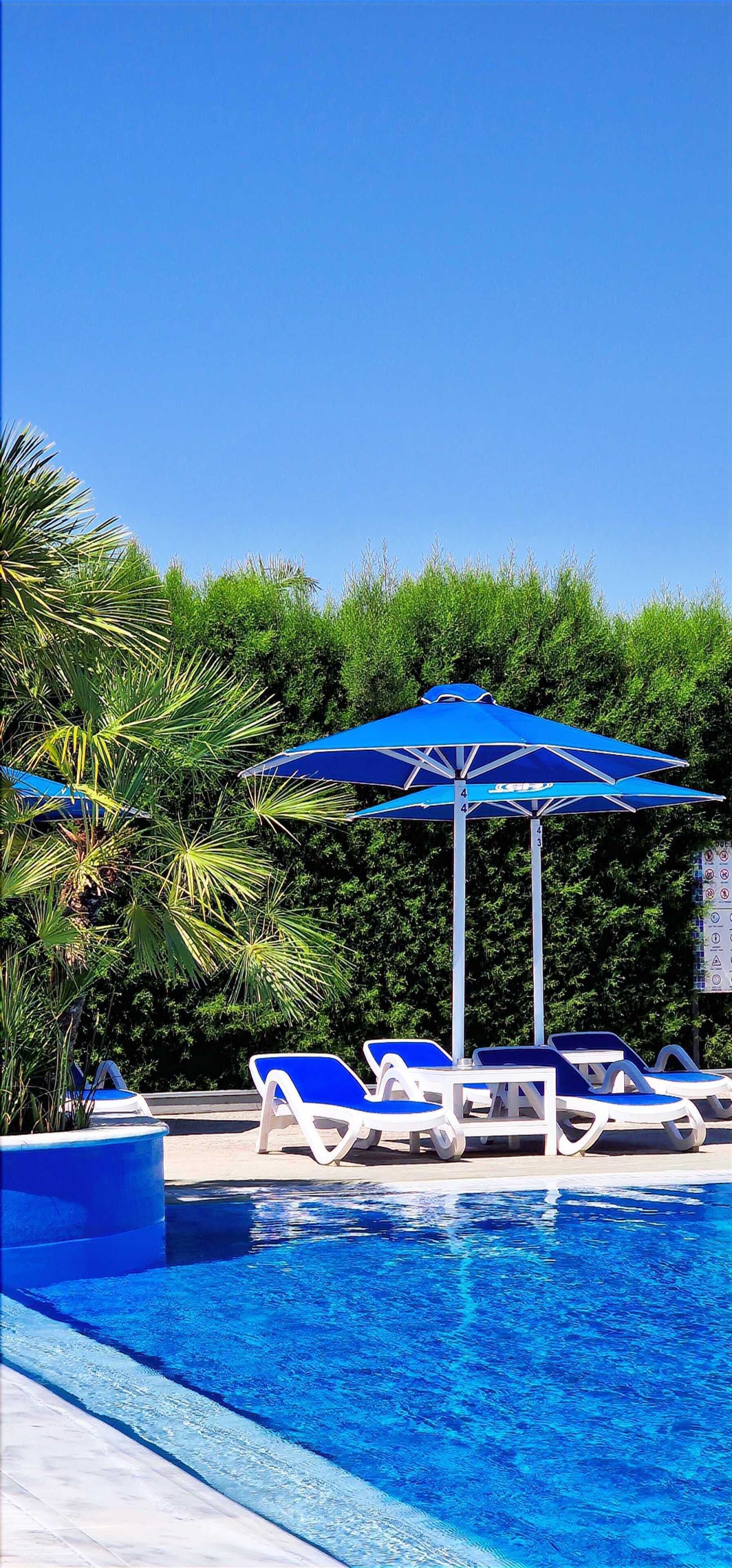 2 outdoor pools, pool umbrellas, pool loungers