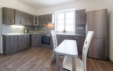 Apartment, Balcony | Private kitchen | Full-size fridge, stovetop, coffee/tea maker, cookware/dishes/utensils