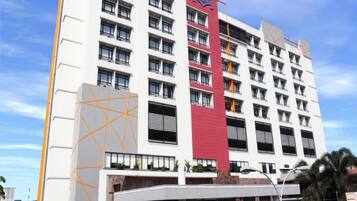 Experience the sleek design of The Grand Pasundan Hotel, featuring balconies on every floor and beautifully maintained surroundings.