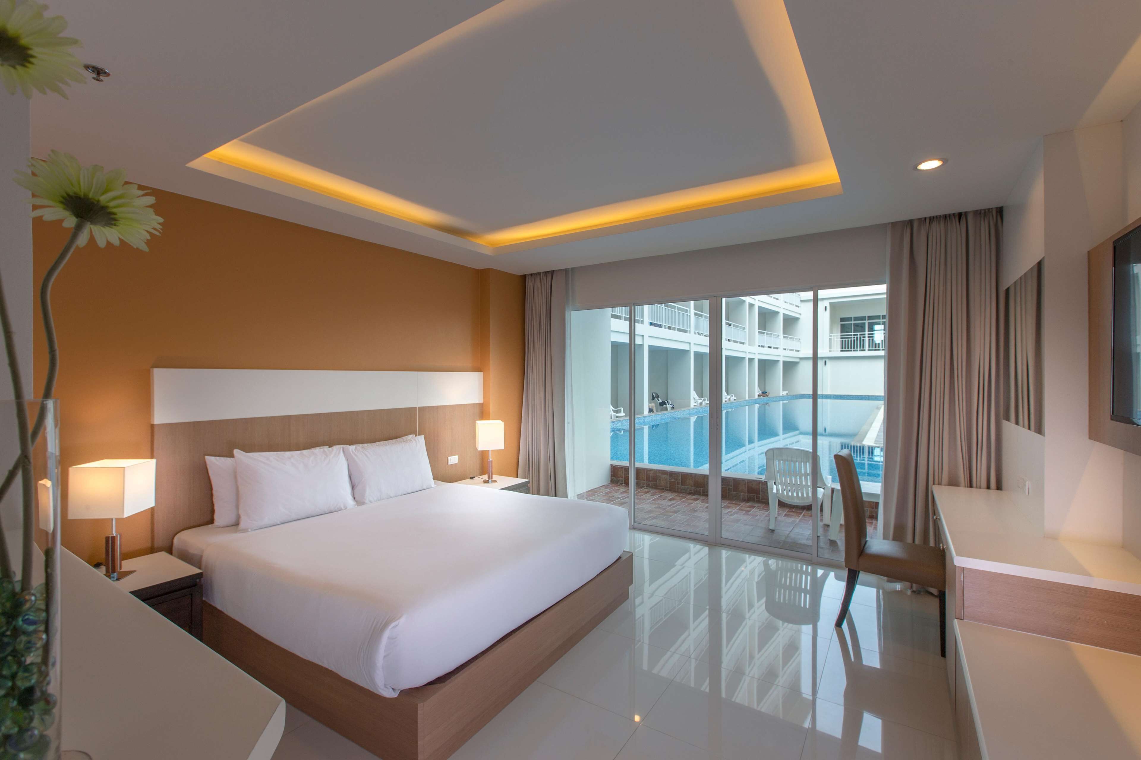 deluxe room, pool access | premium bedding, minibar, in-room safe, desk