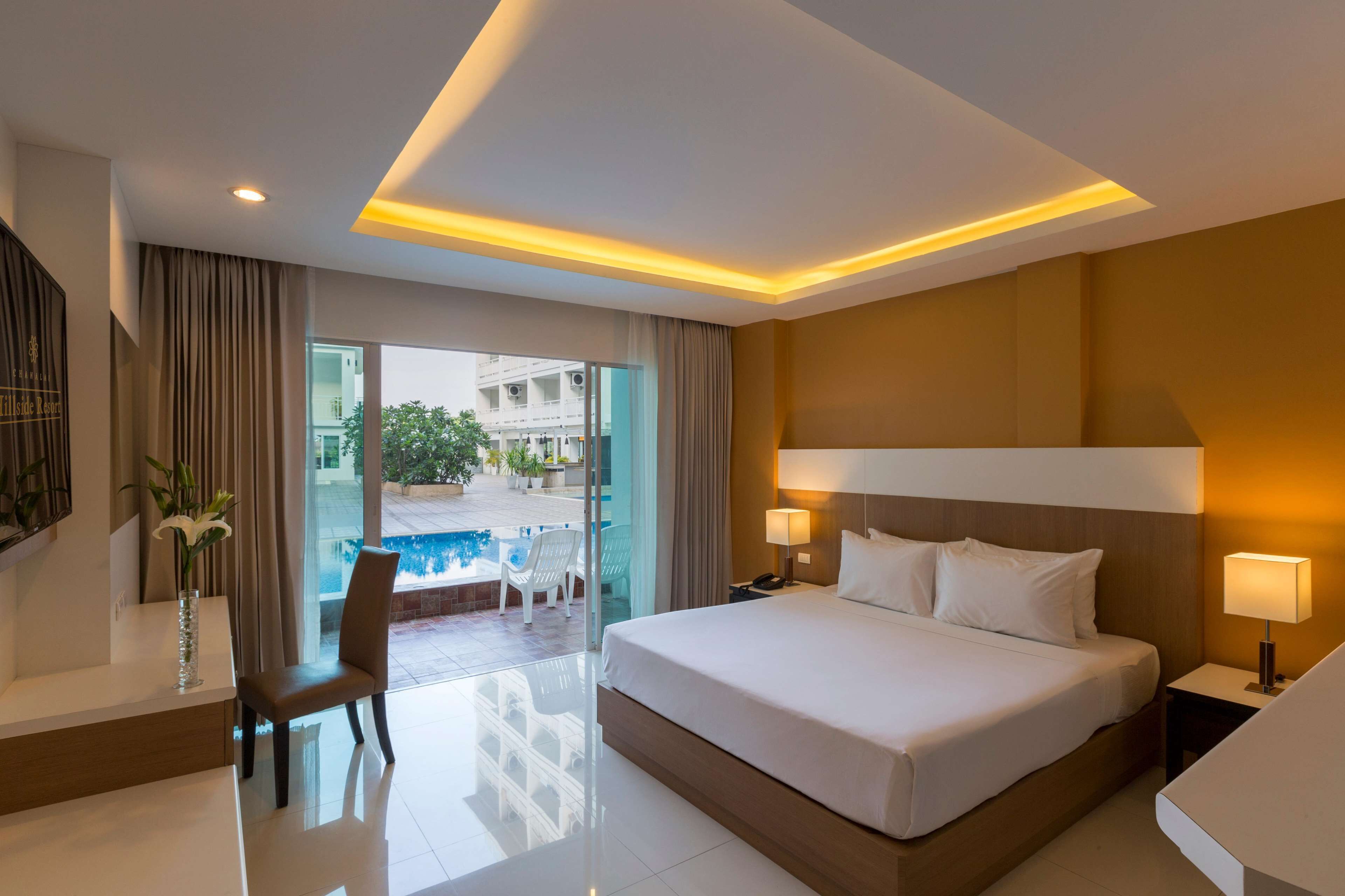 deluxe room, pool access | premium bedding, minibar, in-room safe, desk