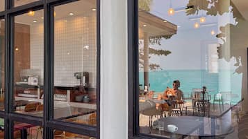 Breakfast, lunch, dinner served; international cuisine, beach views