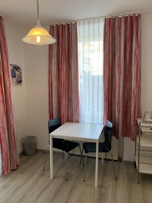 Desk, laptop workspace, blackout curtains, iron/ironing board