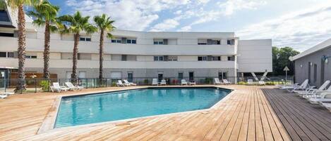 Seasonal outdoor pool, open 10:00 AM to 7:00 PM, sun loungers