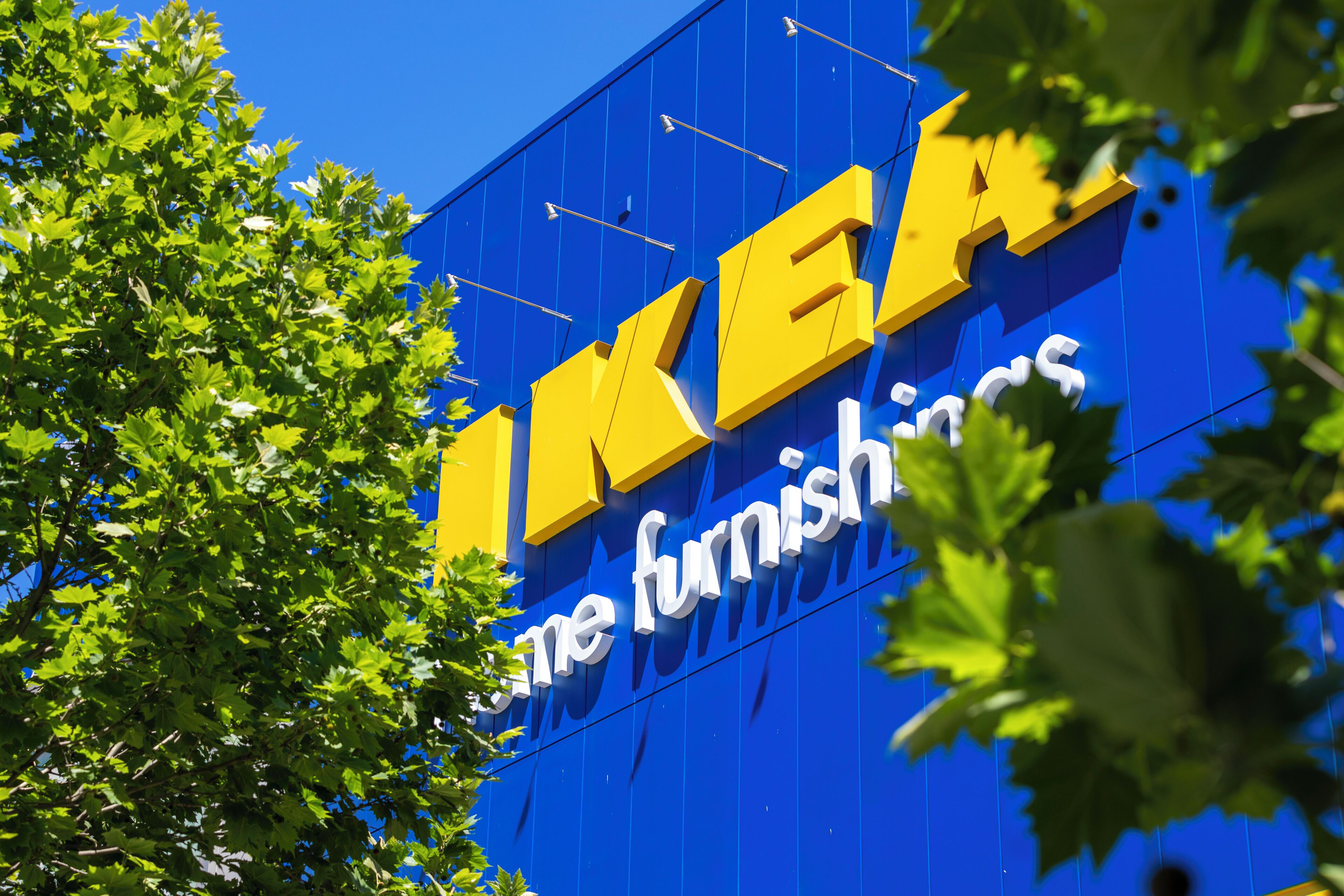 A blue building with the IKEA logo and the words "home furnishings" on it.