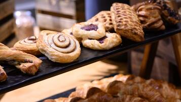 A variety of pastries displayed on a black tray.