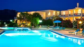 Seasonal outdoor pool, open 10:00 AM to 6:00 PM, pool umbrellas