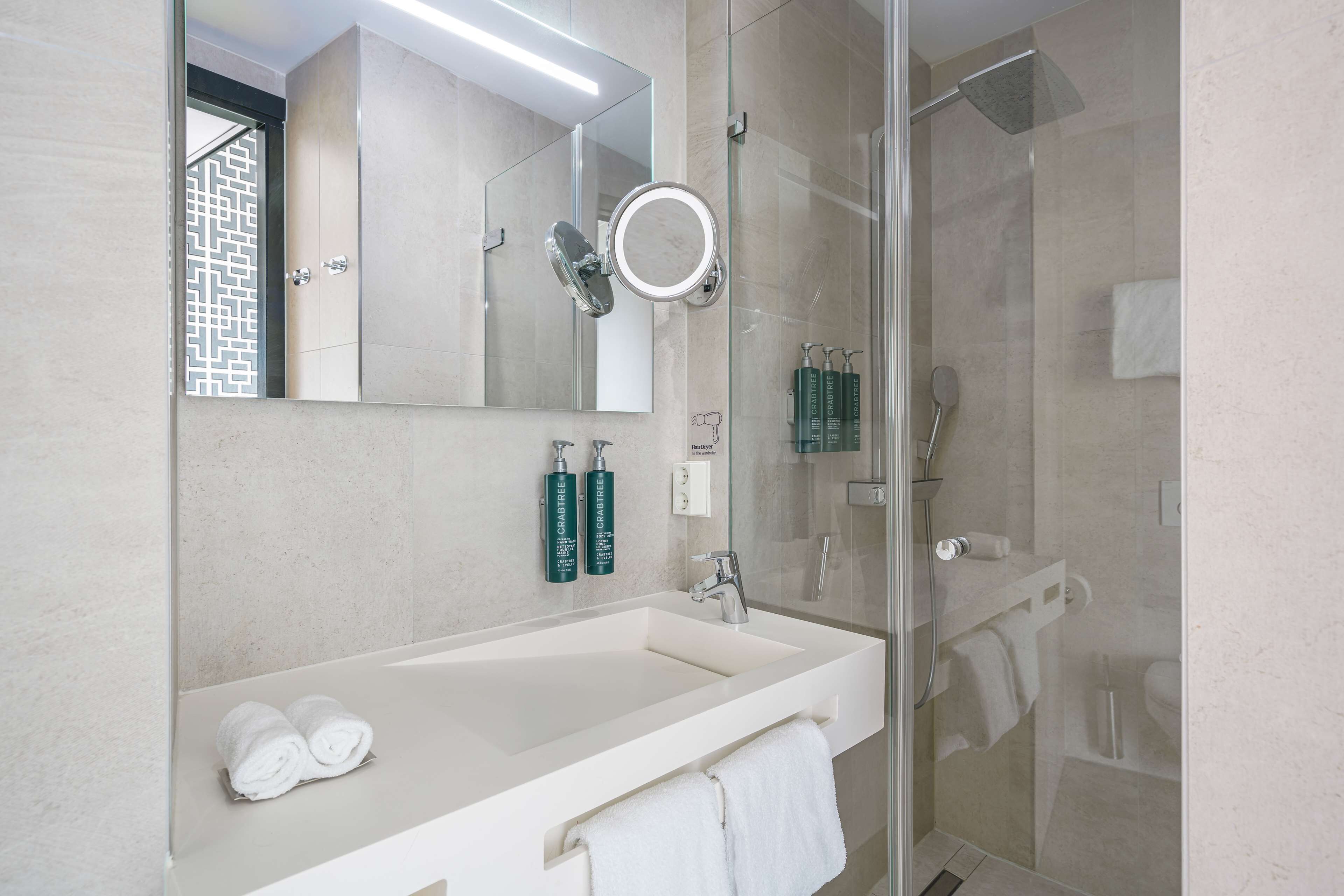 rainfall showerhead, eco-friendly toiletries, bathrobes, slippers