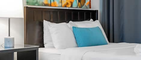 Premium bedding, laptop workspace, blackout curtains, iron/ironing board