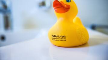 A yellow rubber duck with the text "mmHotels" and contact information on it.
