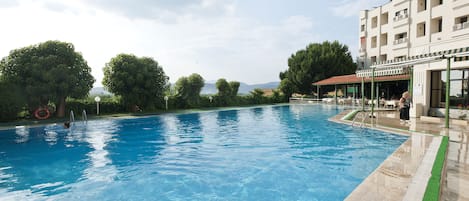 Economy Room, 1 Double or 2 Single Beds, Garden Area | Outdoor pool