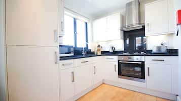 Apartment, 2 Bedrooms | Private kitchen | Fridge, microwave, dishwasher, coffee/tea maker
