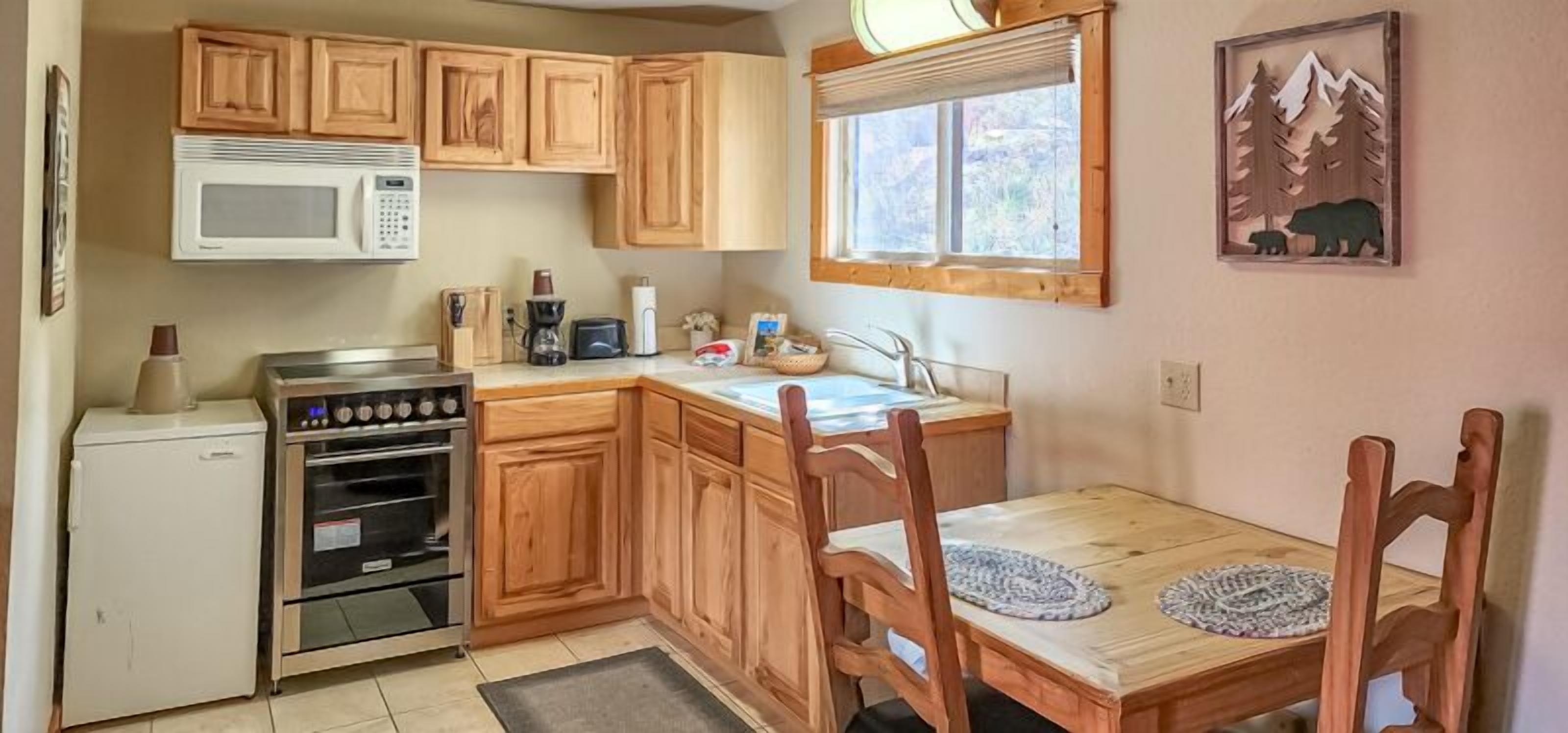 suite, 1 king bed, jetted tub | private kitchen | fridge, microwave, coffee/tea maker