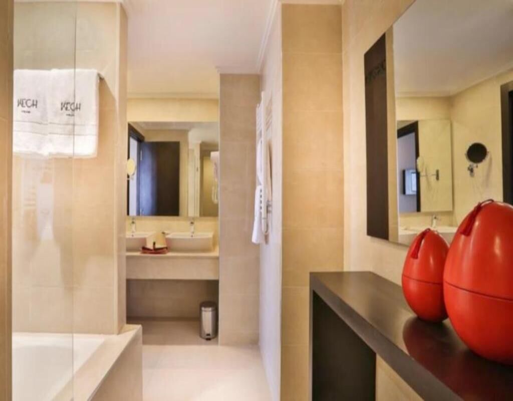 bathtub, deep-soaking bathtub, rainfall showerhead, designer toiletries