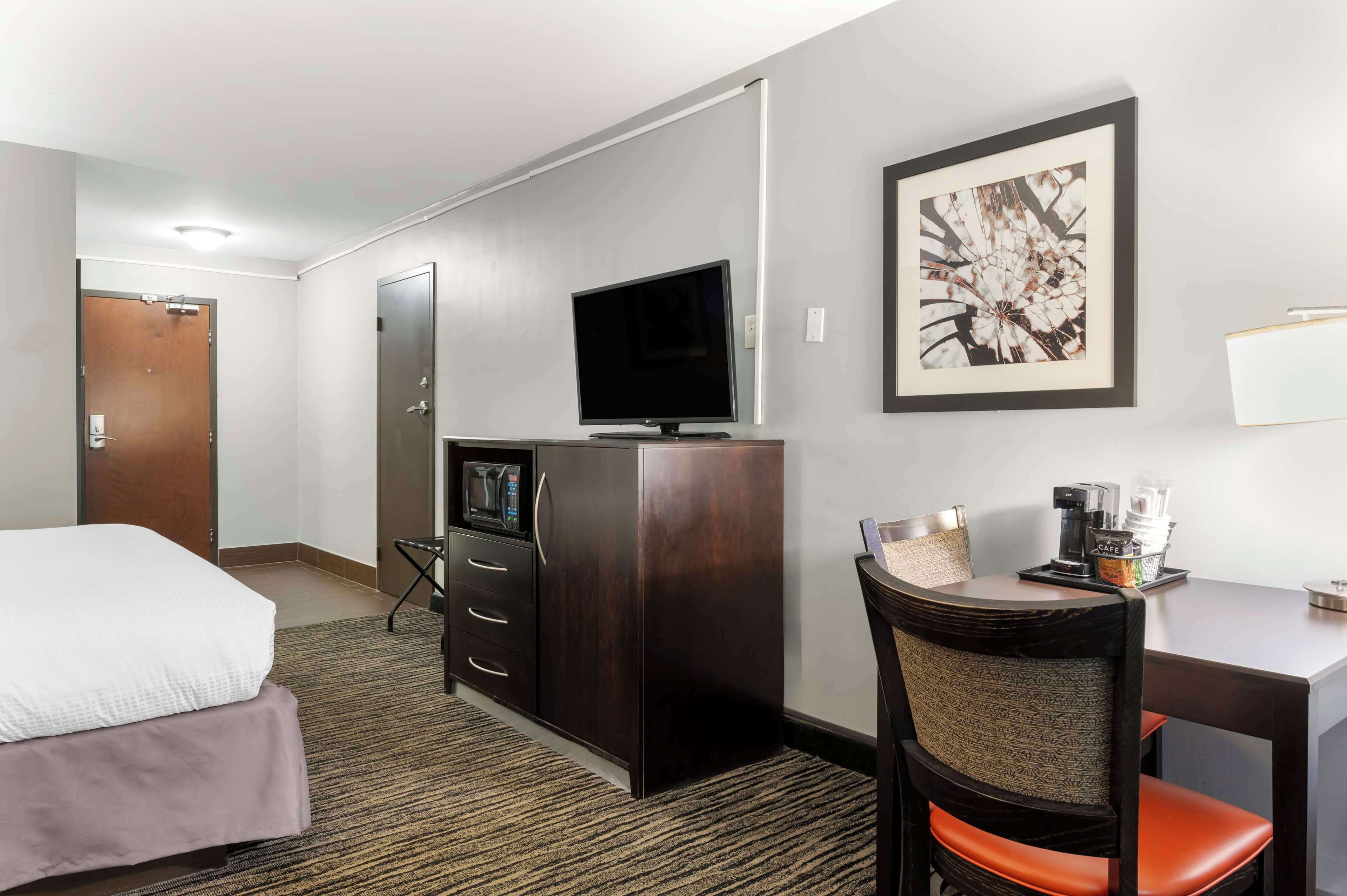 desk, laptop workspace, blackout curtains, iron/ironing board