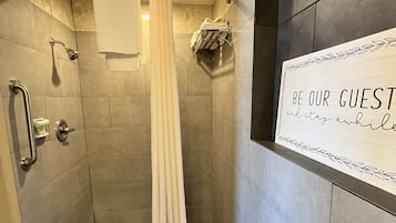 Deluxe Room, 1 King Bed, Non Smoking | Bathroom | Deep-soaking bathtub, free toiletries, hair dryer, bathrobes