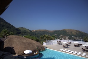 Outdoor pool, pool umbrellas, sun loungers