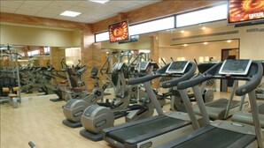A gym with multiple treadmills, ellipticals, and other cardio equipment. - Elite 5 (Manama)