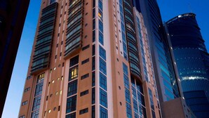 A high-rise hotel with a prominent 'Jumeirah' sign, multiple floors, and a modern architectural design. - Elite Tower (Manama)