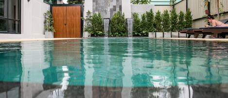Outdoor pool, pool umbrellas, sun loungers