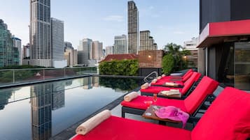 Outdoor pool, open 7:00 AM to 10:00 PM, pool umbrellas, pool loungers