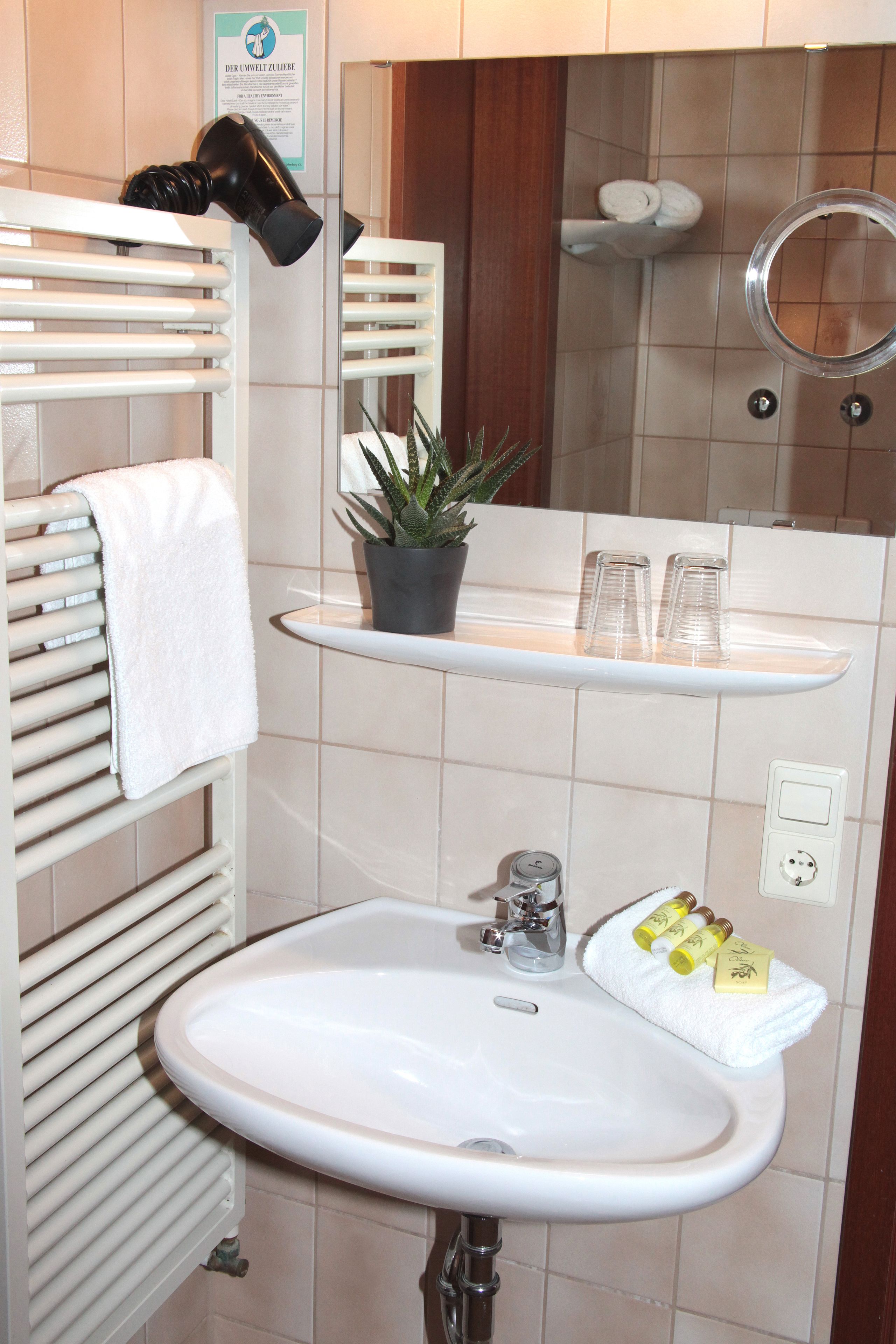 deep-soaking bathtub, free toiletries, hair dryer, towels