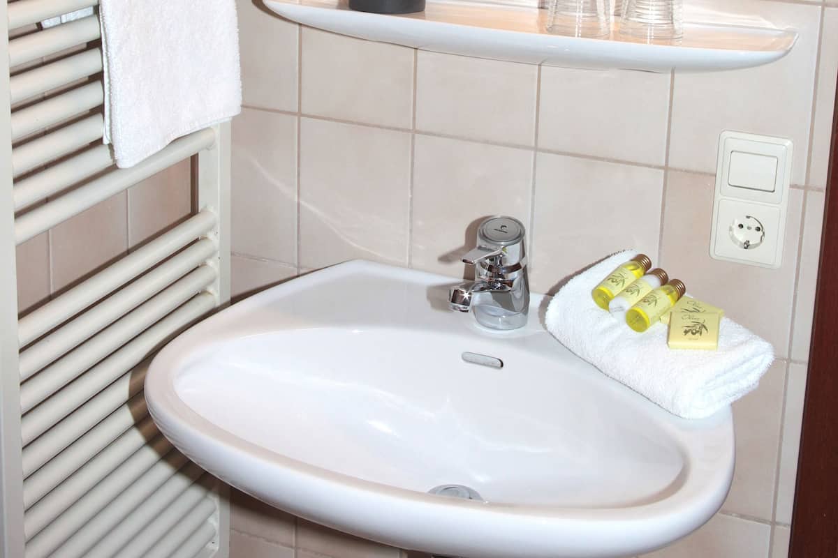 deep-soaking bathtub, free toiletries, hair dryer, towels