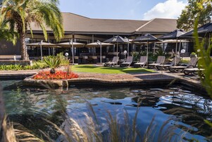 Outdoor pool, pool umbrellas, sun loungers