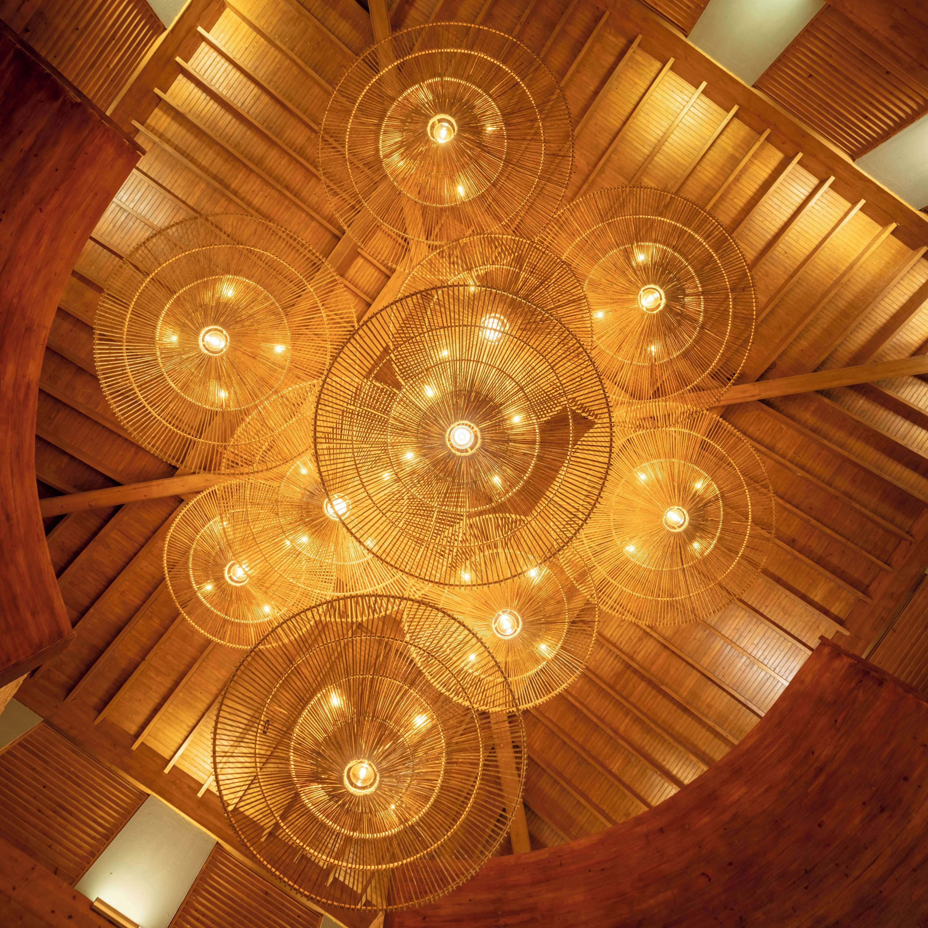 A wooden ceiling with circular light fixtures.