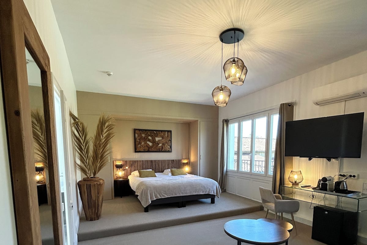 Quadruple Suite Garden View | Premium bedding, soundproofing, iron/ironing board, free WiFi