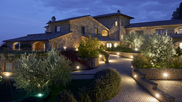 A large stone house with multiple arches and a paved driveway leading to the entrance. - Altarocca Wine Resort Adults Only (Orvieto)