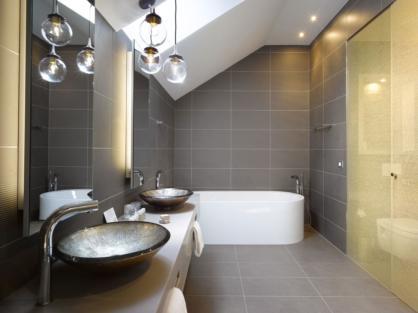 Bathroom | Designer toiletries, hair dryer, towels, soap