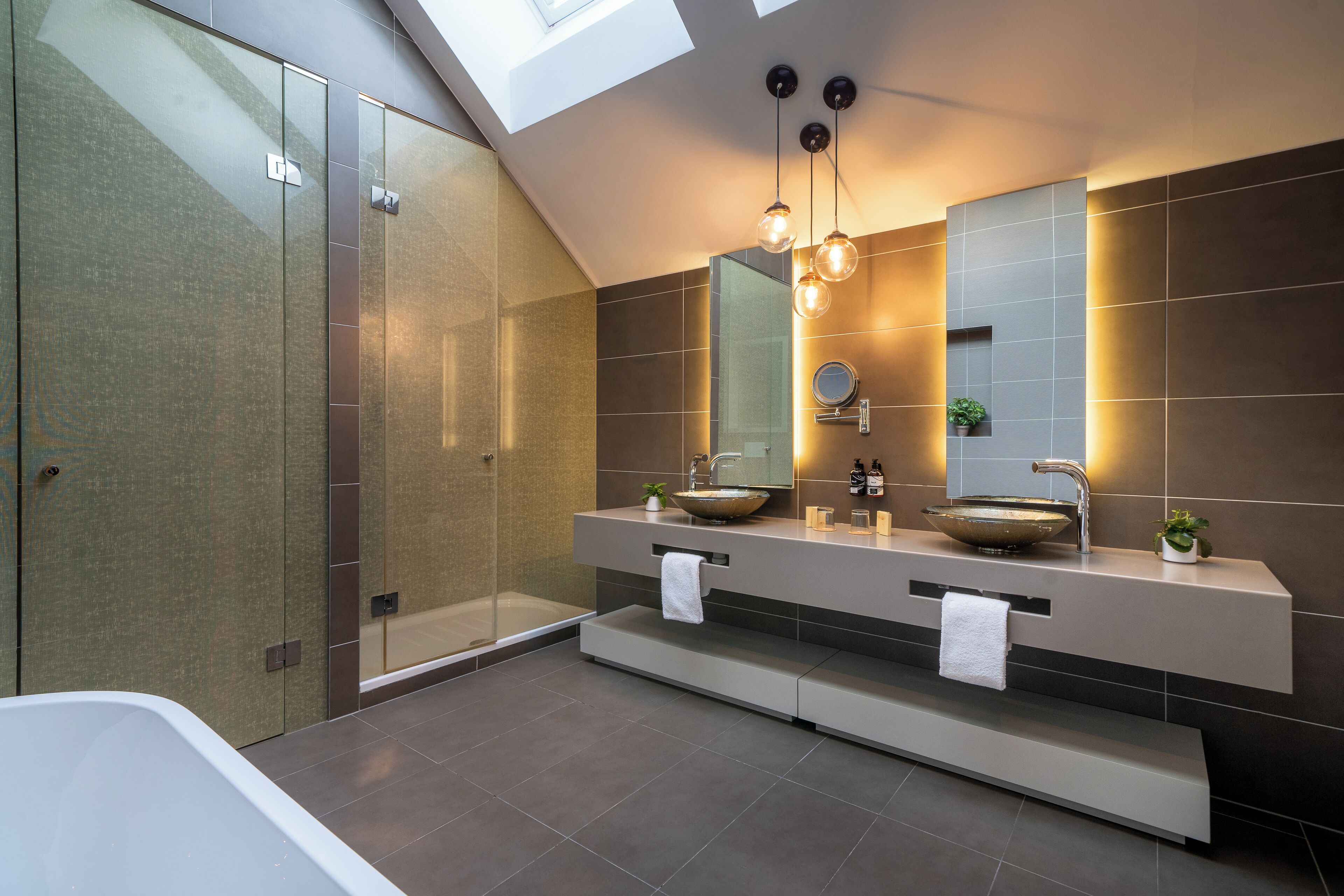 designer toiletries, hair dryer, towels, soap