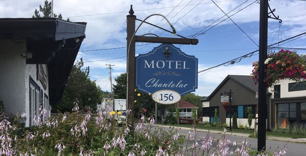 A motel sign with the name "Chantalac" and the number "156".