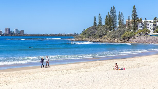 A beach with clear skies, waves, and a few people. - The Mirage Alexandra Headland (Alexandra Headland)