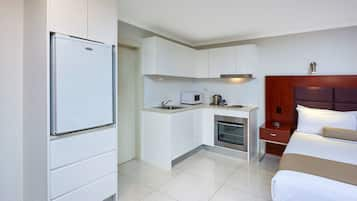 Deluxe Room, Multiple Beds, Non Smoking, Balcony | Private kitchen | Electric kettle