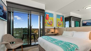 A modern hotel room with a large bed, a seating area, and a balcony with a view. - Mercure Bendigo Schaller (Bendigo)