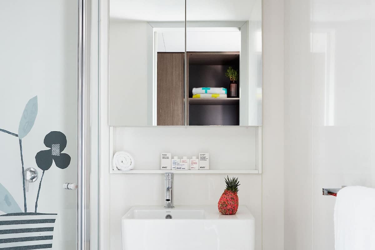 shower, designer toiletries, hair dryer, towels