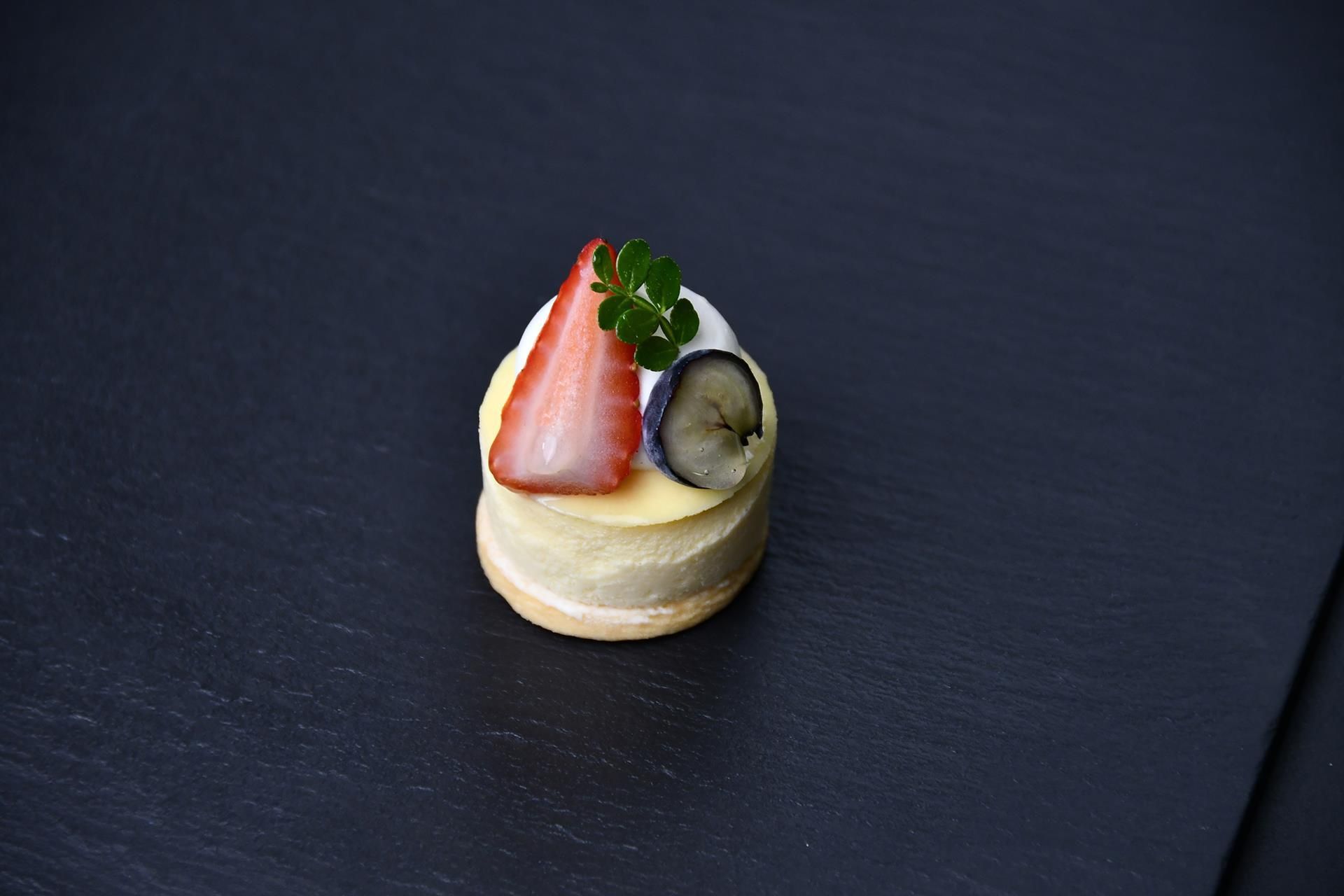 A dessert on a dark slate surface.