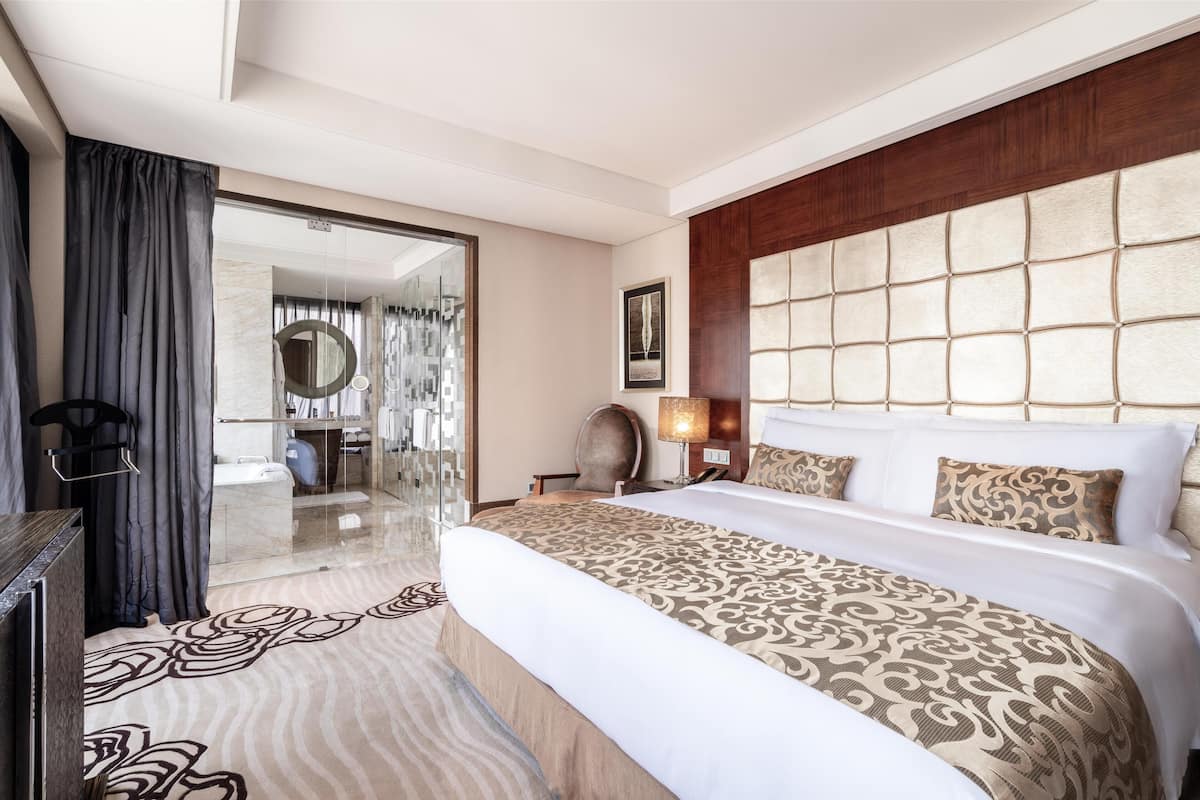 suite, 1 king bed, city view | down duvets, minibar, in-room safe, desk